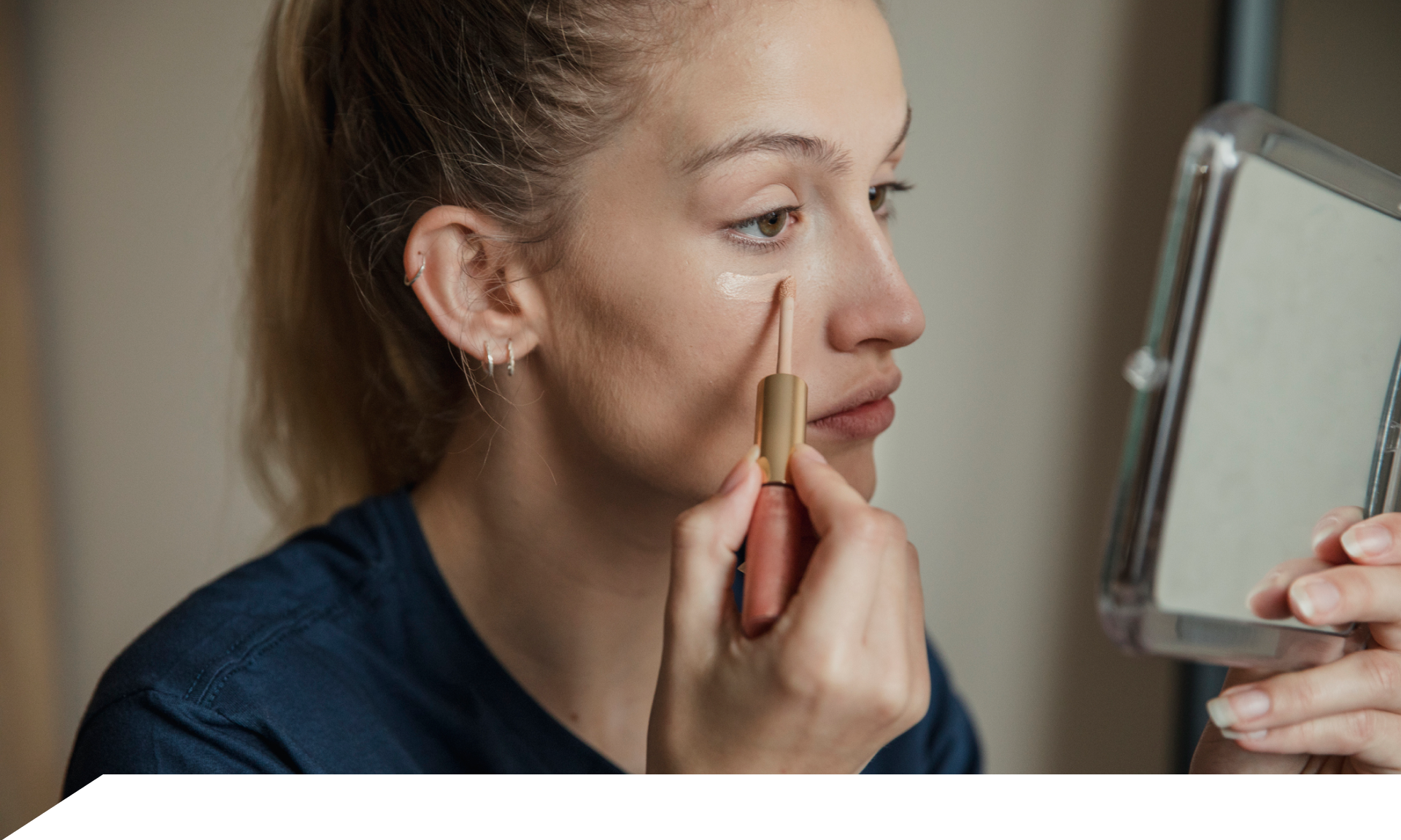 Woman putting on makeup