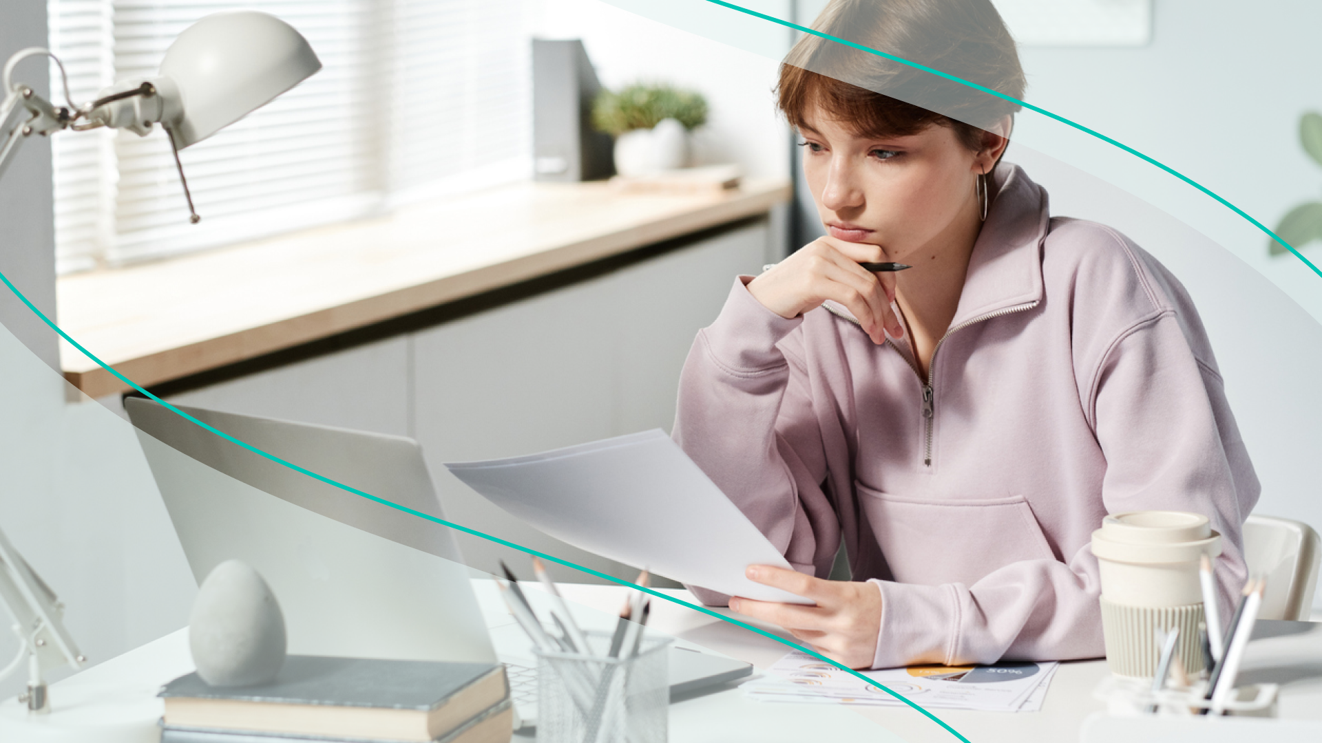 accessibility, woman reviewing paperwork at her desk