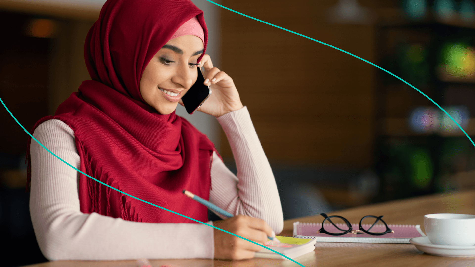 Woman Talking On Phone Taking Notes 