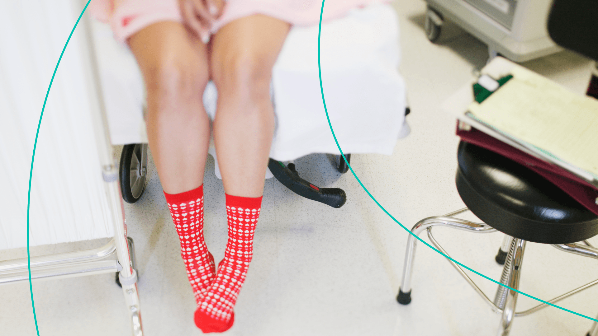 Woman's feet hanging off hospital bed in long red socks