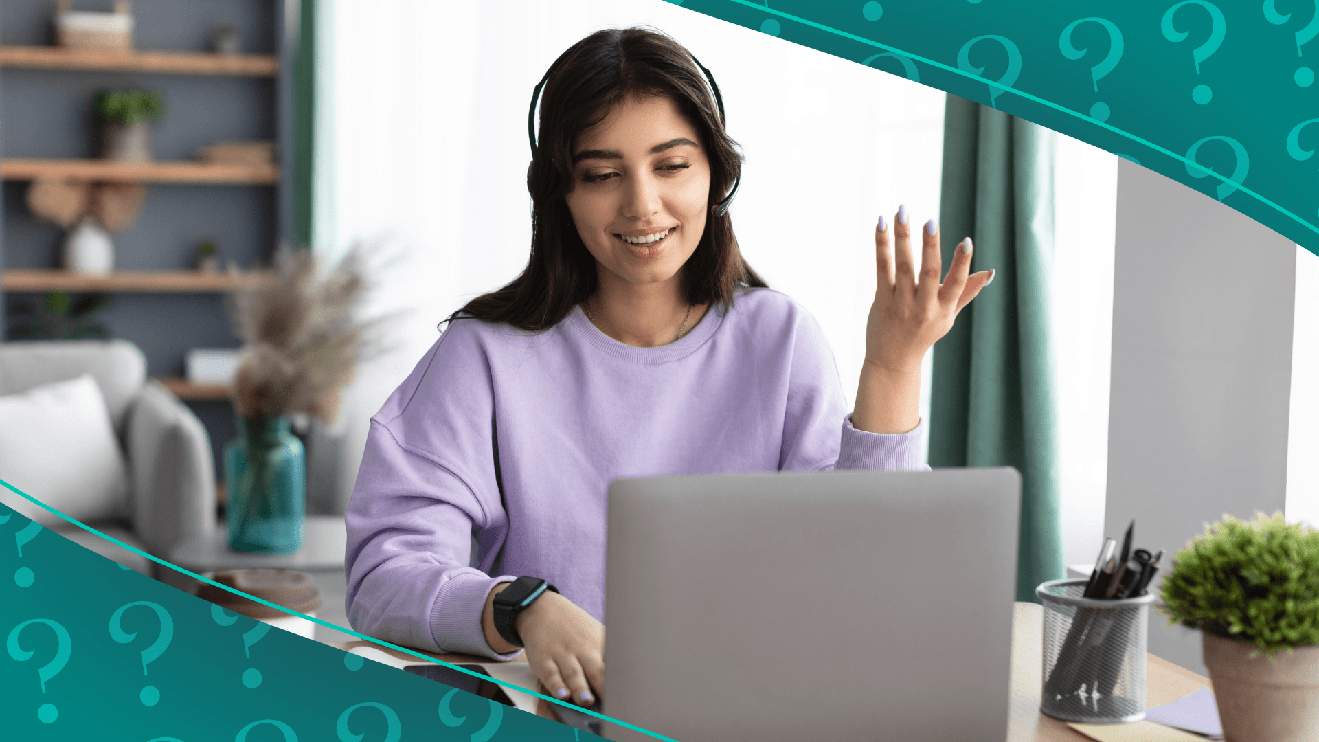 Woman with headphones on looking at computer with hand up