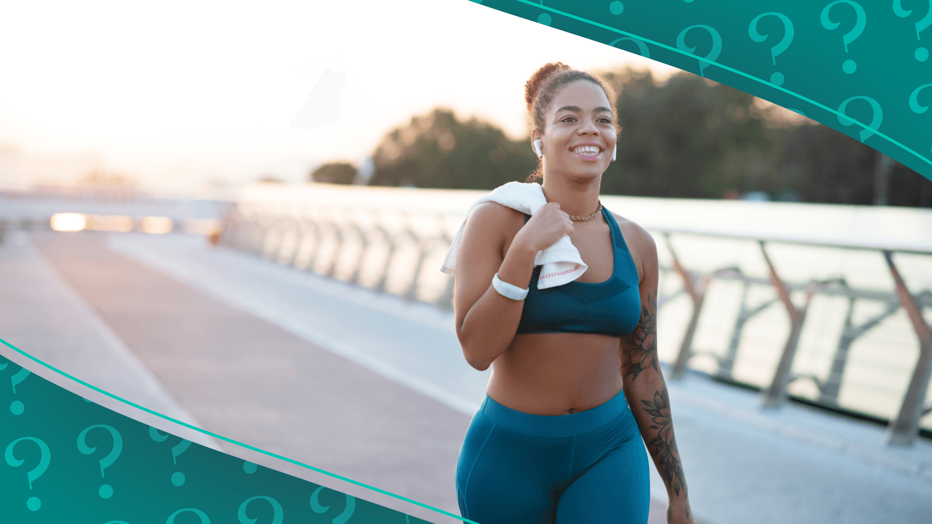 woman walking in workout clothes in the morning on an empty bridge