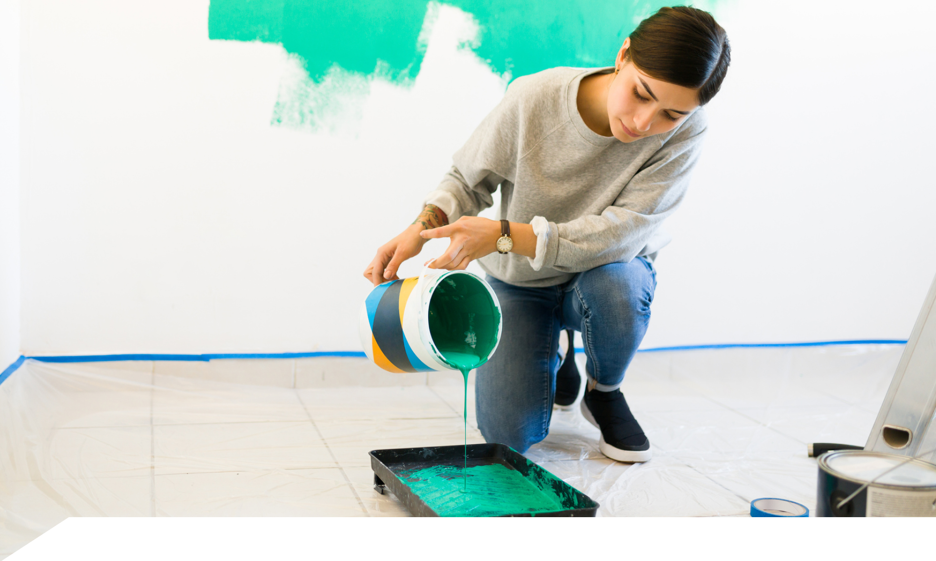 Woman pours green paint into container