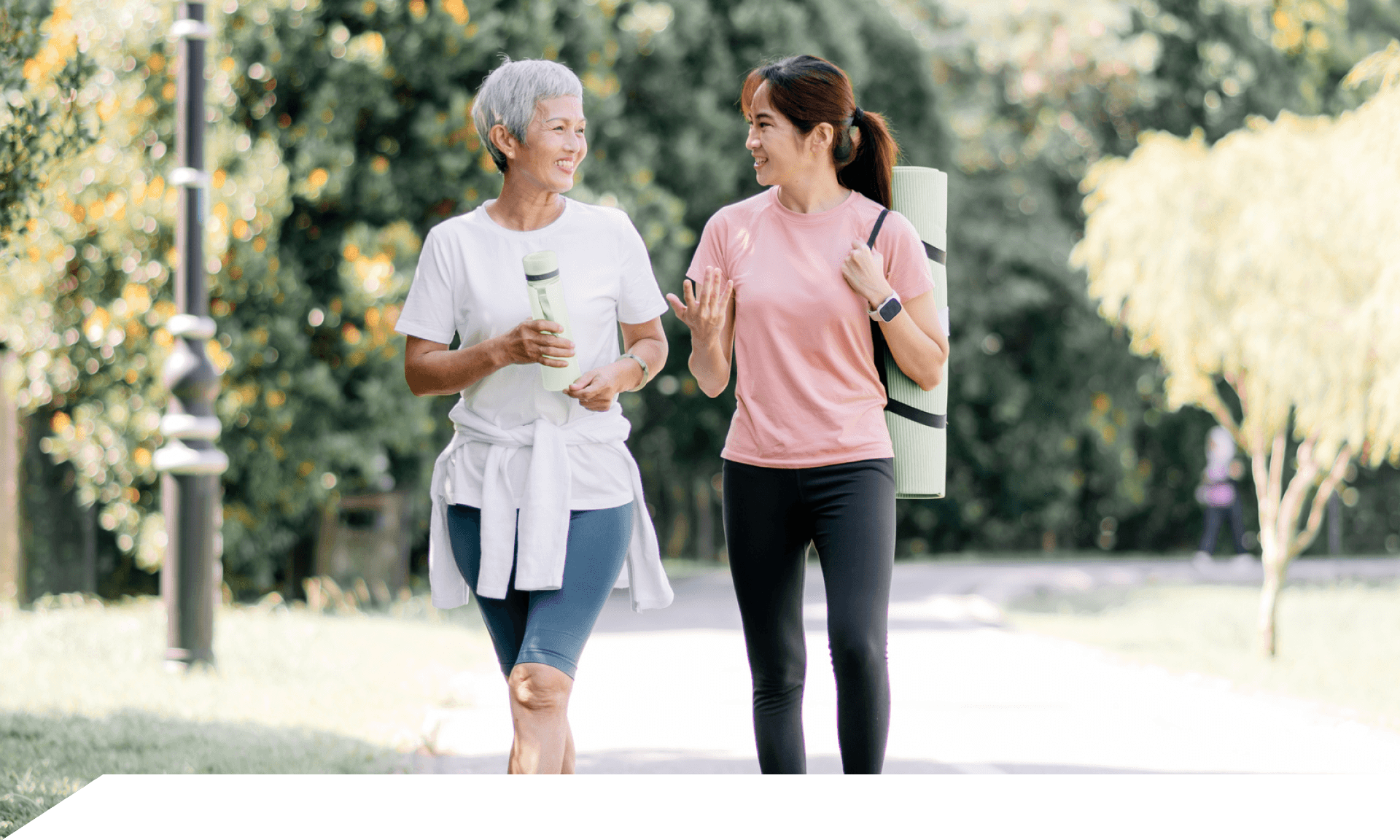 Younger woman and older woman walking outside