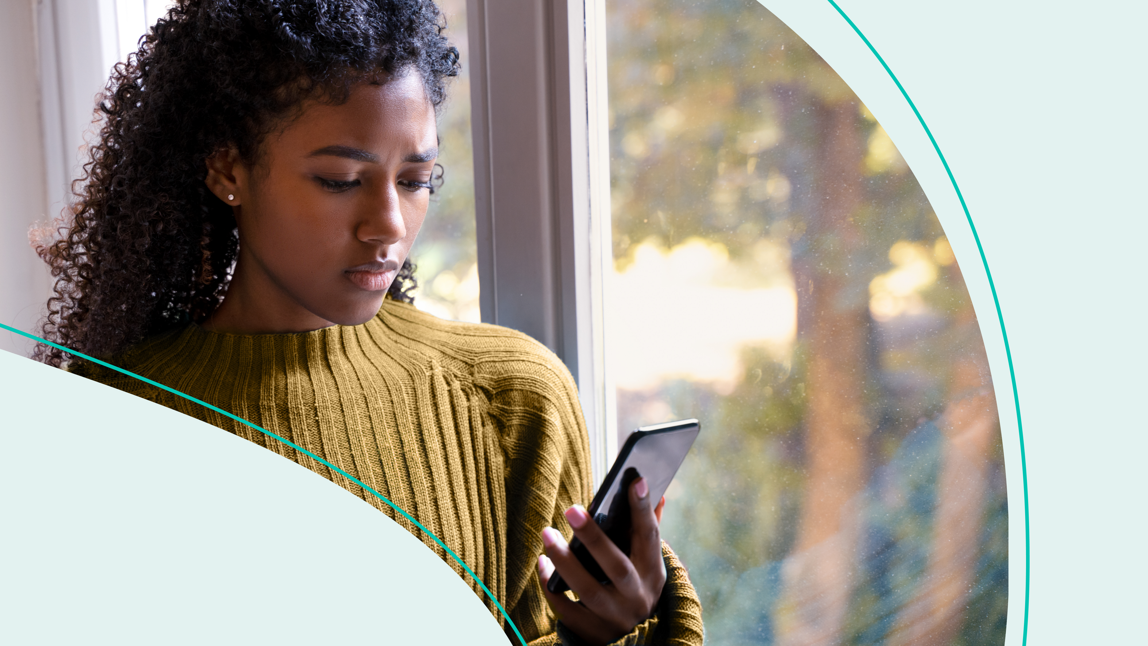 Woman appears concerned while reading phone