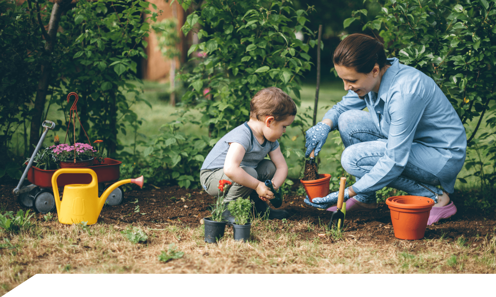 Woman gardening with her child