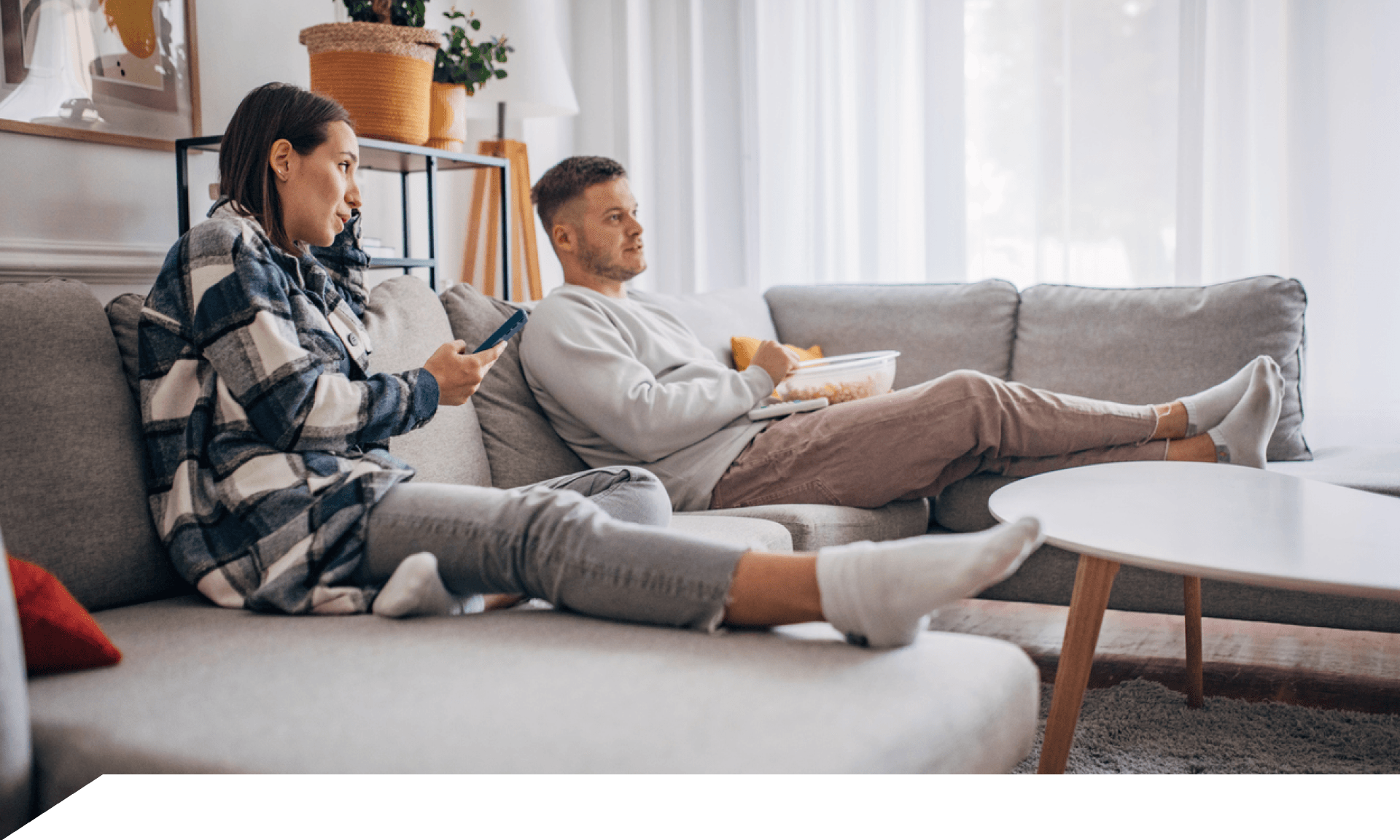 couple watching tv on couch