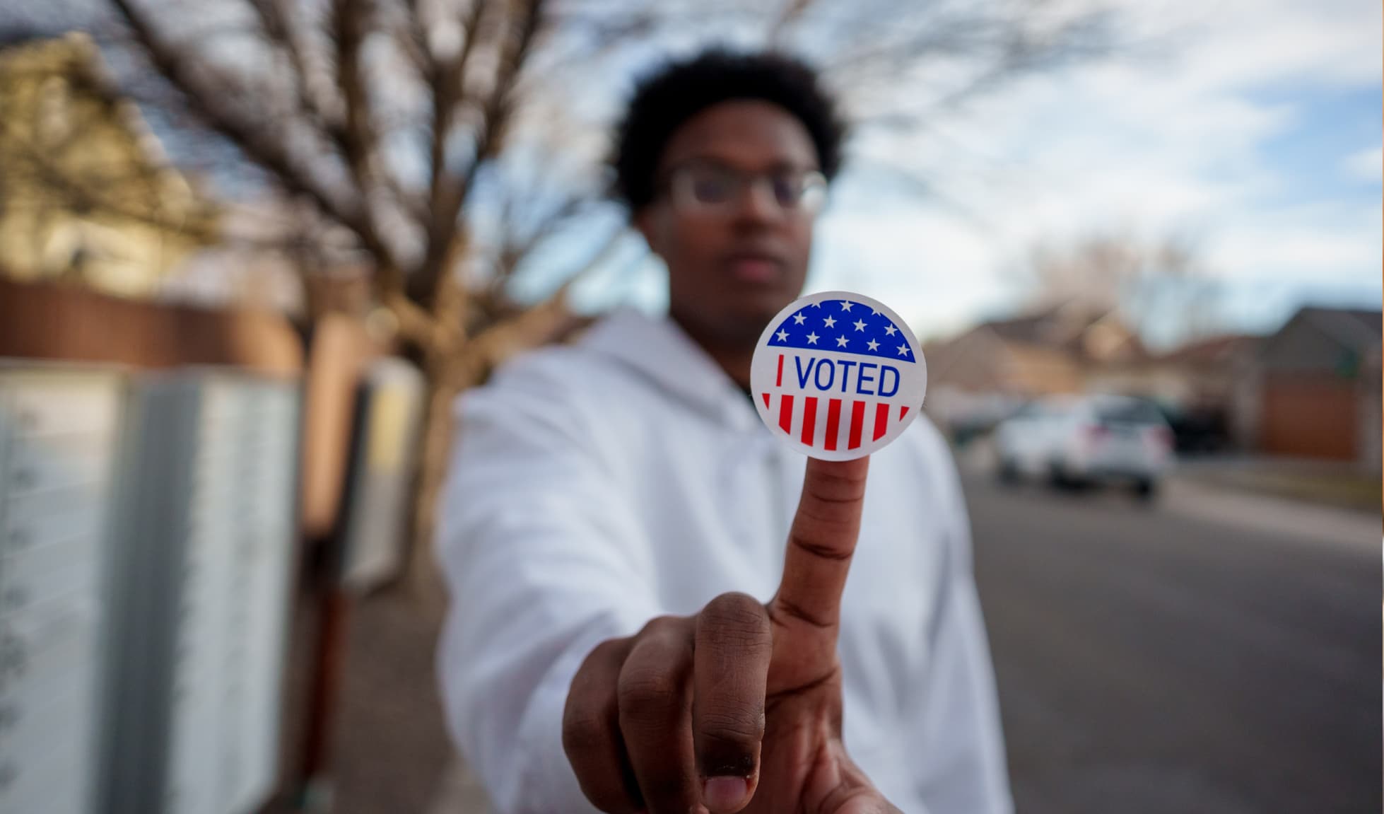 Man with an "I voted" sticker