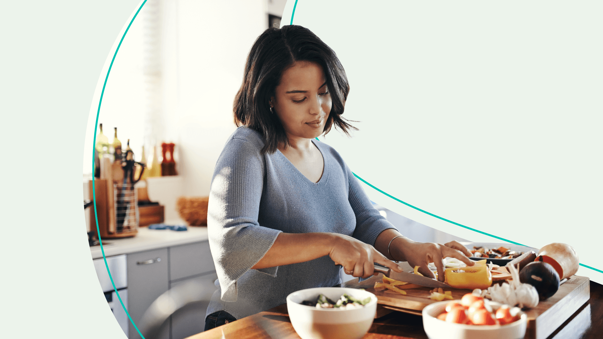 Woman chopping food in kitchen